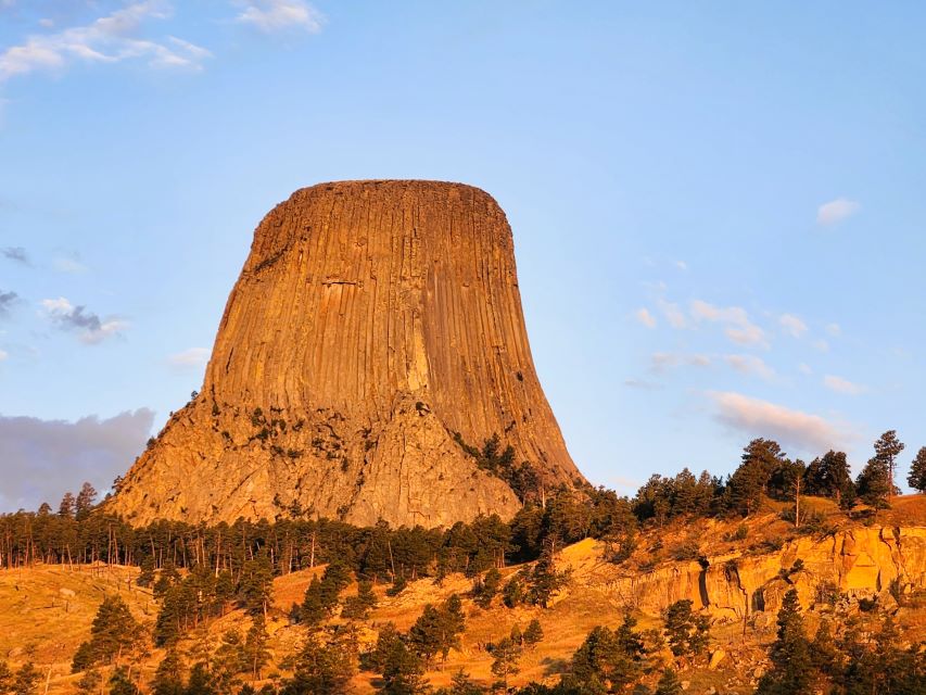 The is a view of the early morning sun radiating off of Devil's Tower.